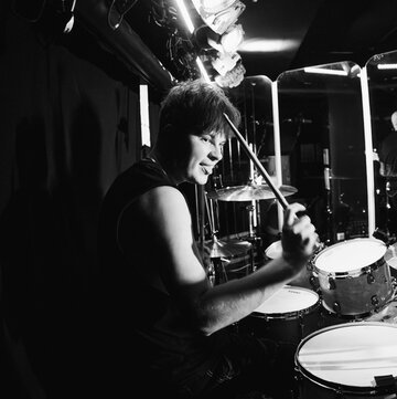 Hire Loz Riley Drummer with Encore