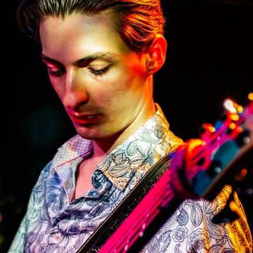 Hire Adam Steele Bass guitarist with Encore