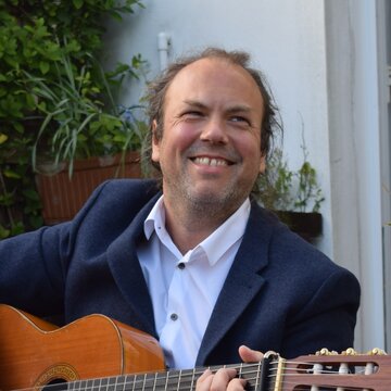 Hire Benjamin Cox-Smith Spanish guitarist with Encore