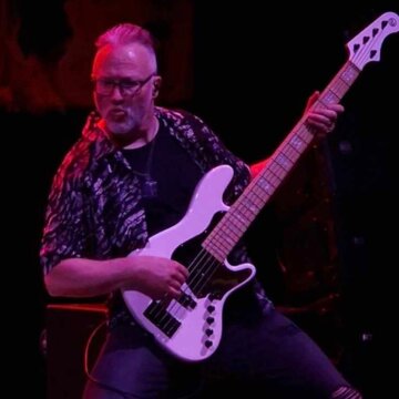 Hire Neil Newsome Bass guitarist with Encore