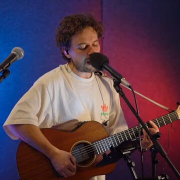 Hire Sam Gillies Singing guitarist with Encore