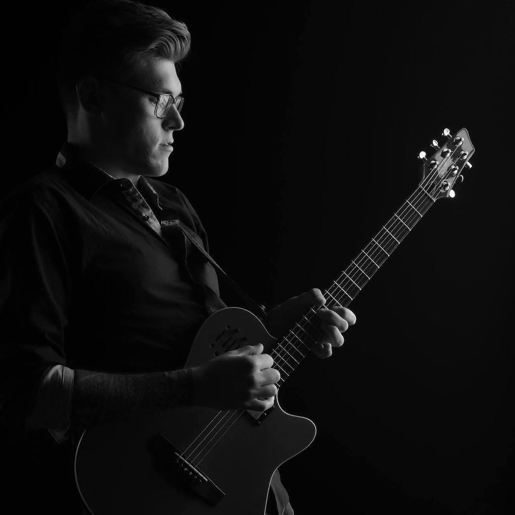 Hire Danny Shamess Singing guitarist with Encore