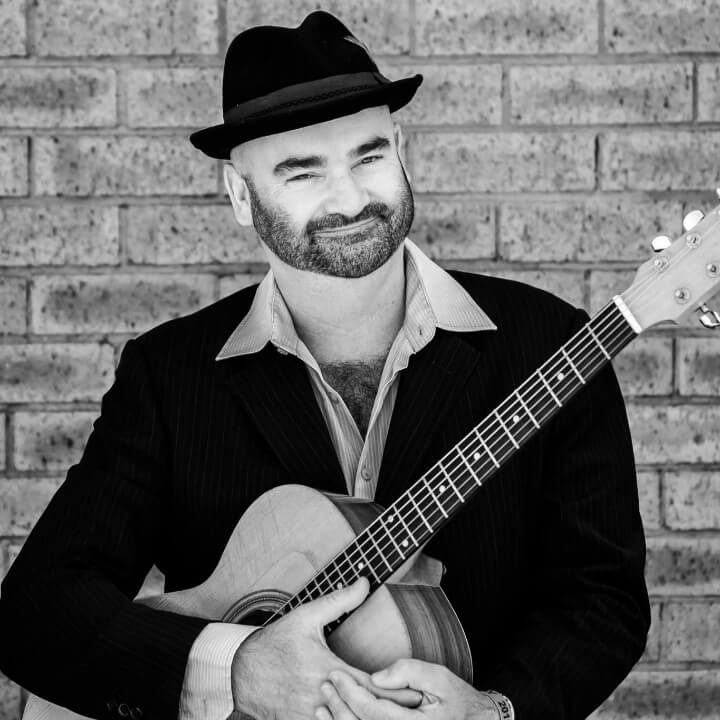 Hire Tim Pringle Singing guitarist with Encore