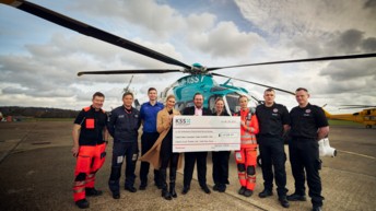 London Gatwick Airport staff present Air Ambulance Charity Kent Surrey Sussex with cheque for nearly £30,000 following fundraising efforts