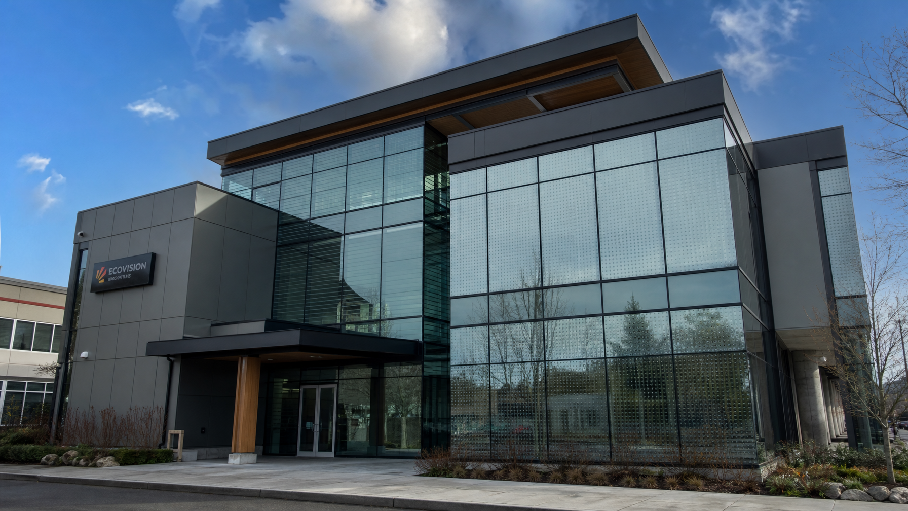 British Columbia office building facade showing bird-safe window film with horizontal line and dot fritting patterns