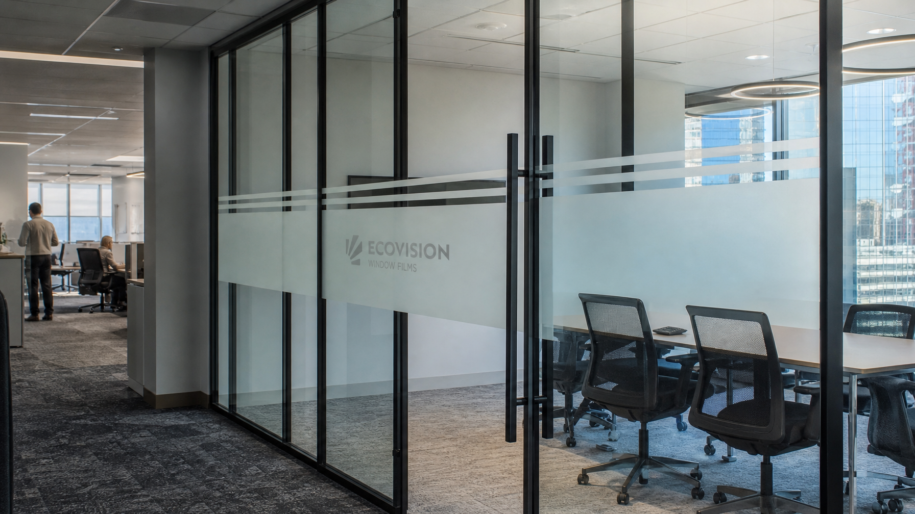 Modern Vancouver BC office interior with frosted privacy film on glass partition walls and conference room doors, soft diffused natural light
