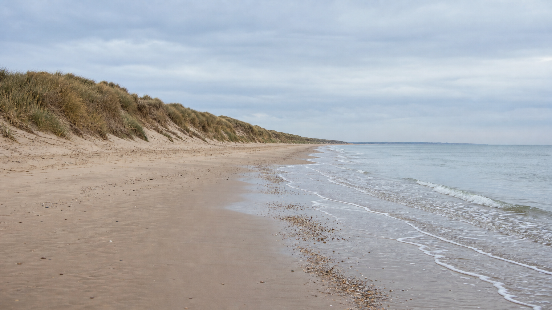 Wide dog-friendly sandy beach and dunes on the North Norfolk Coast, UK