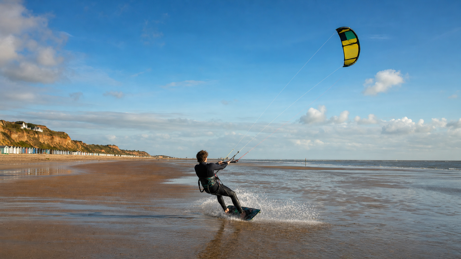 Kitesurfer on a wide North Norfolk beach near Old Hunstanton, Norfolk, UK