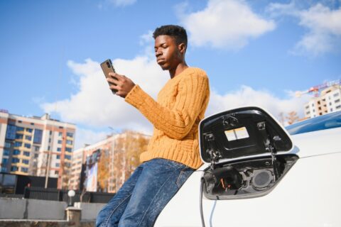 Adobe Stock 467891147 Man charging car orange