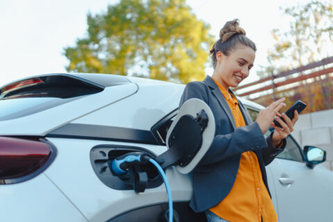 Adobe Stock 547866056 Woman charging car