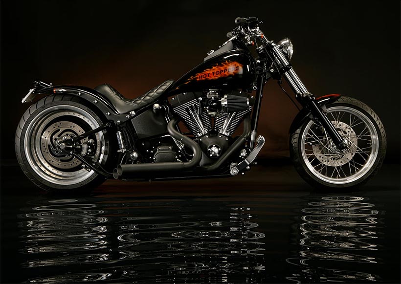 Motorcycle sitting on a water-like floor.