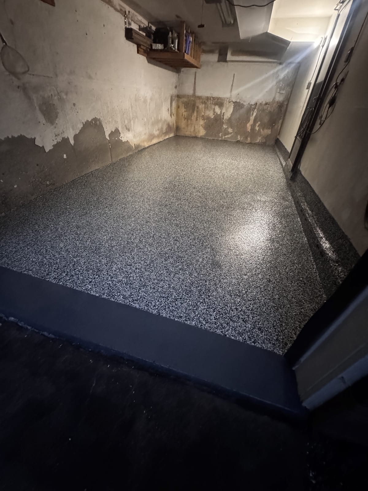 Grey flake epoxy garage floor with white walls