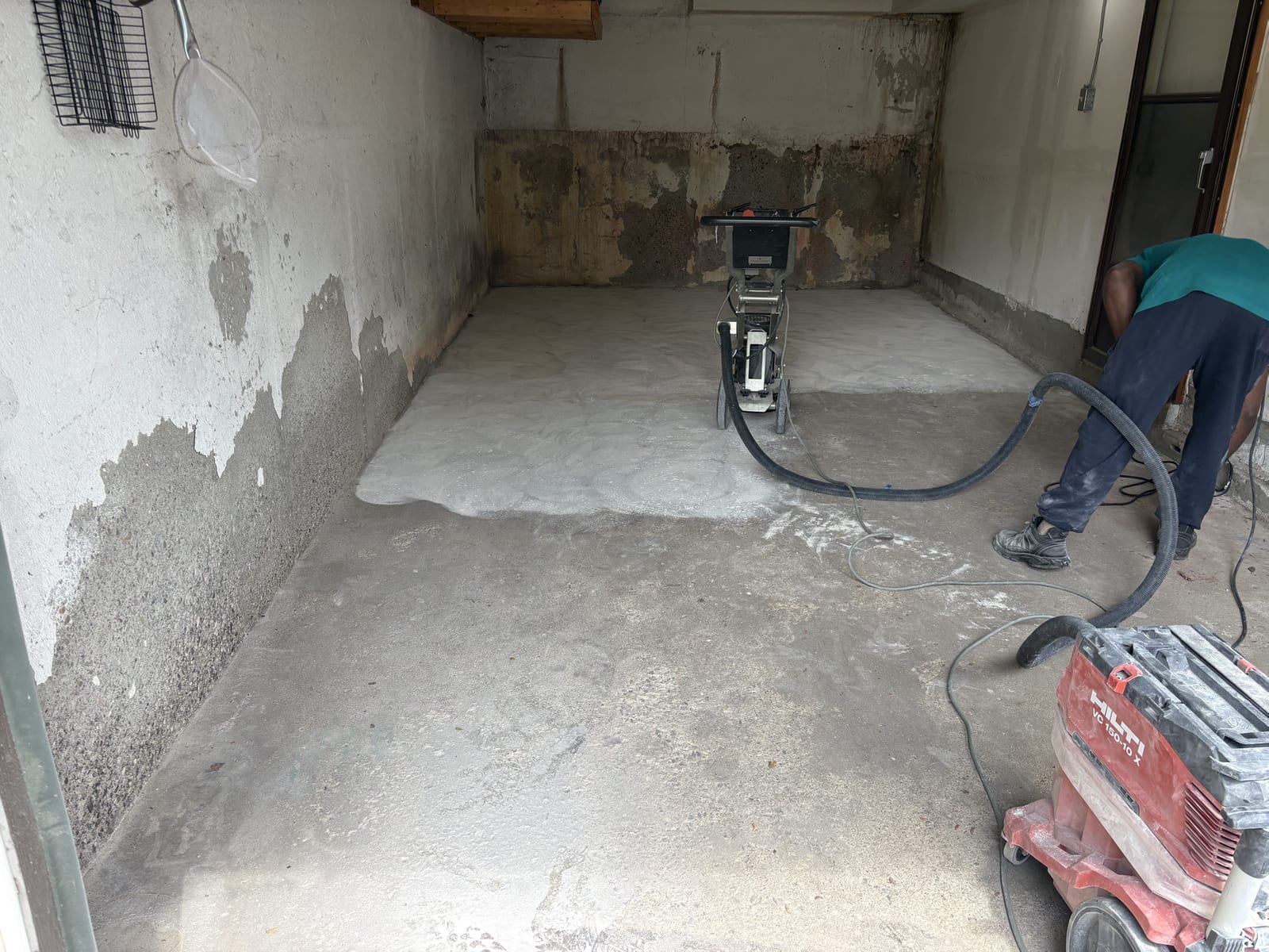 Floor grinding machine preparing concrete surface