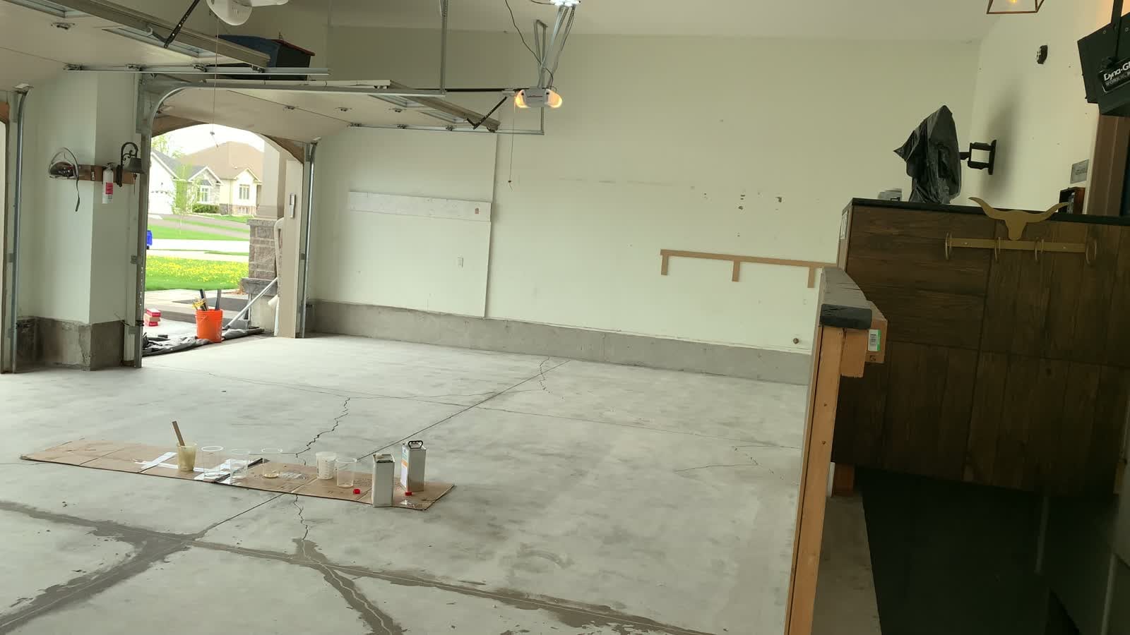 Bare concrete garage floor after grinding preparation