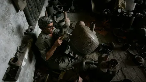 Retratos Grabados en Lápidas: Una Práctica que Preserva Recuerdos en Pakistán