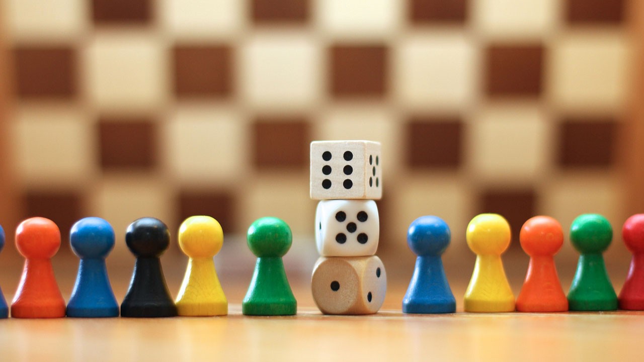 young people playing board games