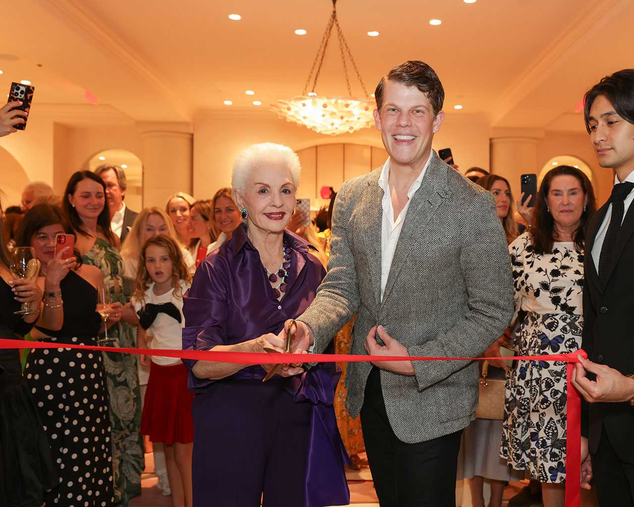 Creative Director Wes Gordon joined by Founder Carolina Herrera cut the ribbon to officially mark the opening of the boutique to boisterous cheer and warm welcome from the Palm Beach community.