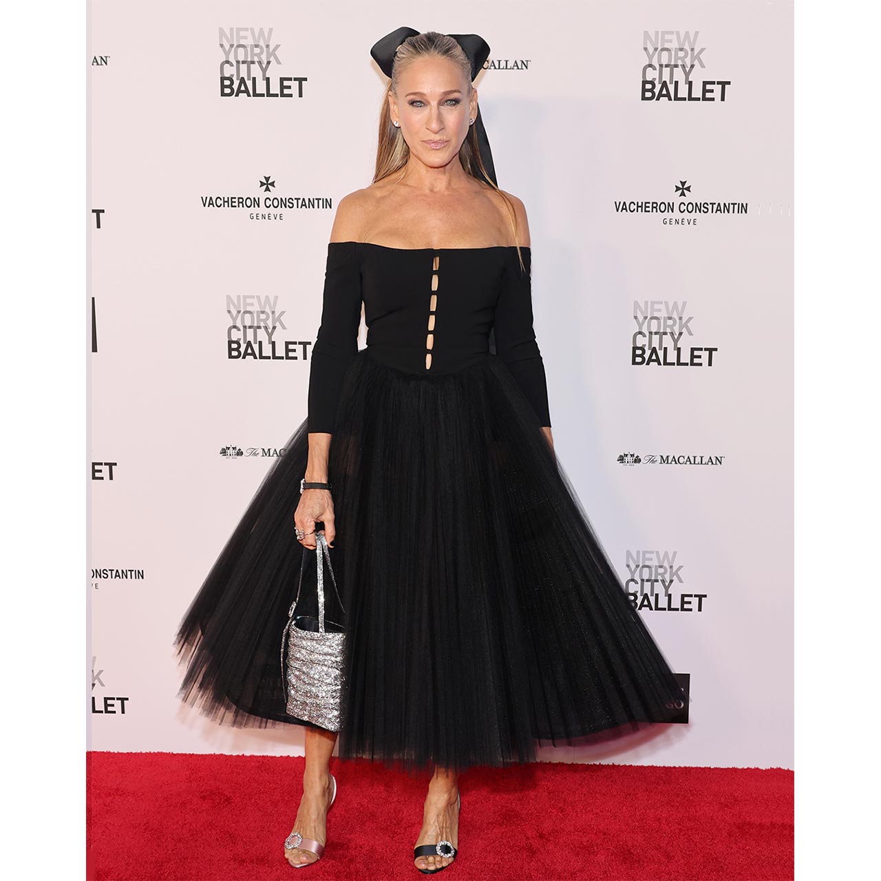 Gala Chair, Sarah Jessica Parker, wore a sophisticated black tulle midi dress from the Fall Winter 2023 collection.