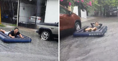 Pareja usa colchón inflable como lancha tras inundación por tormenta