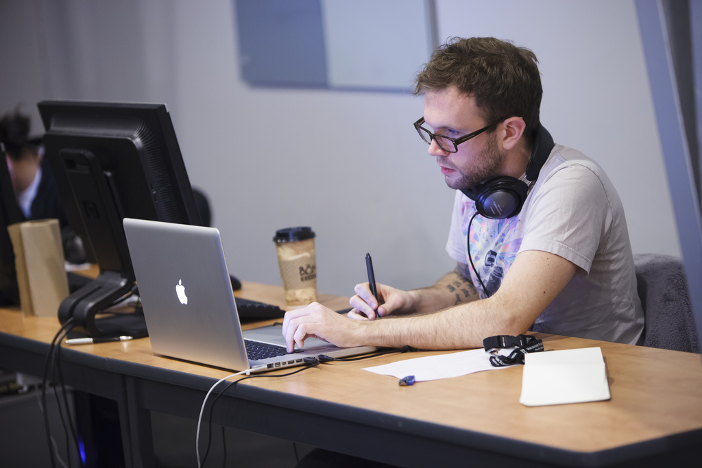 image of man at desk