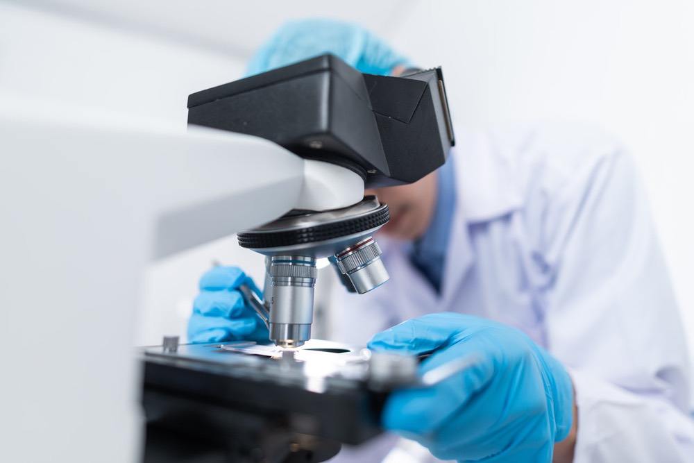 Pathologist at microscope
