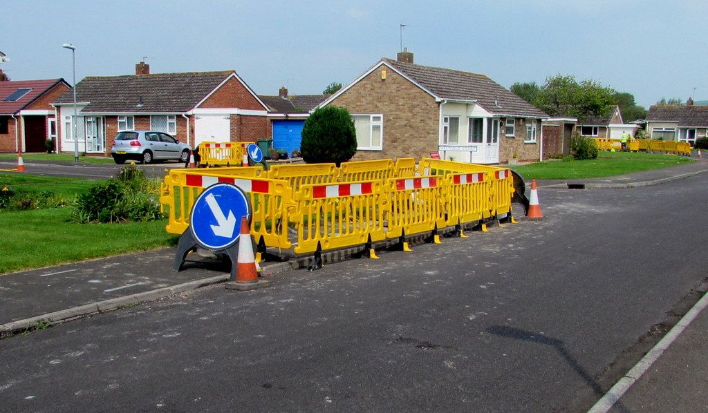 Yellow temporary barriers on the Westfield Drive pavement, Burnham-on-Sea