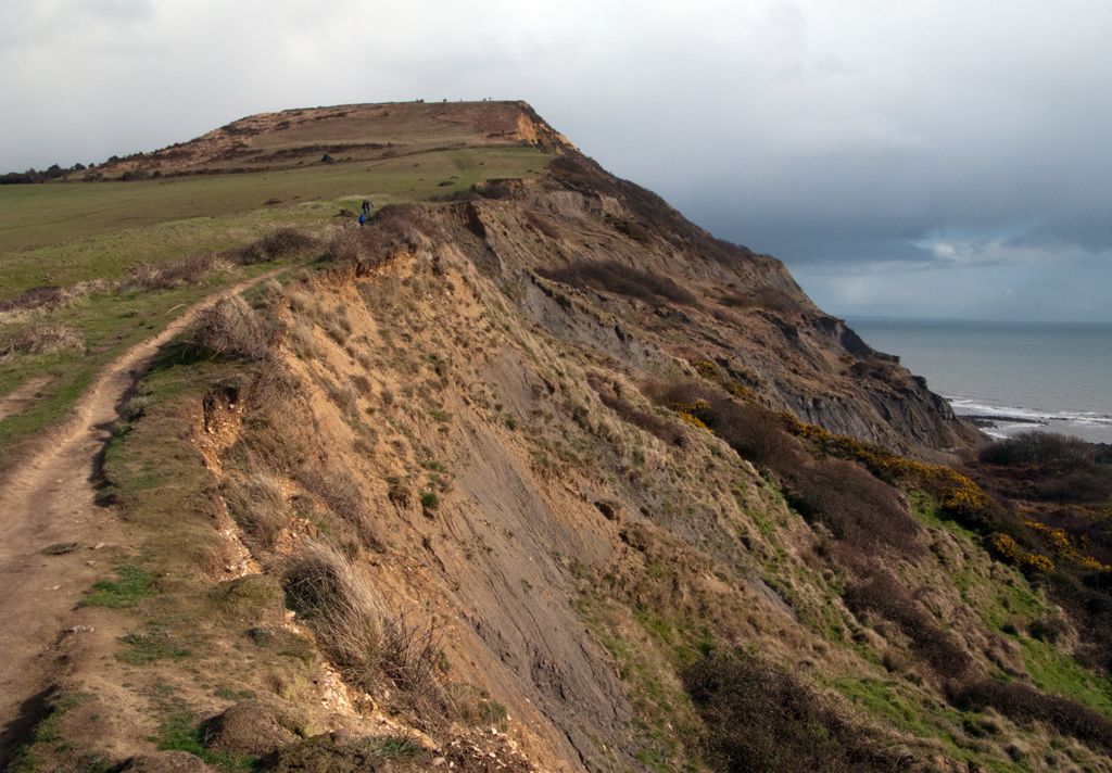 Crumbling cliff edge with path rising for Golden Cap