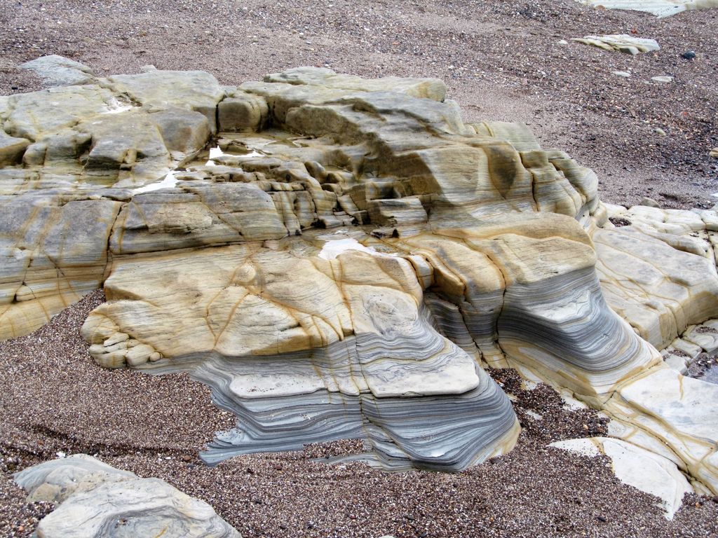 Colourful rocks on Amble beach