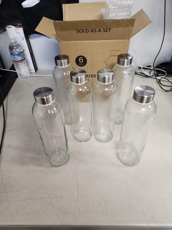 ***USED***Sursip 24oz Glass Water Bottle Set of 6, Leak Proof Clear glass juice bottle for juicing, Reusable Drinking Bottles with Stainless Steel Lid, Beverage Storage Containers for Refrigerator-BPA Free | EZ Auction