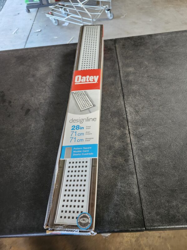 "Oatey Designline 28 in. Stainless Steel Linear Shower Drain with Square Pattern Drain Cover" | EZ Auction