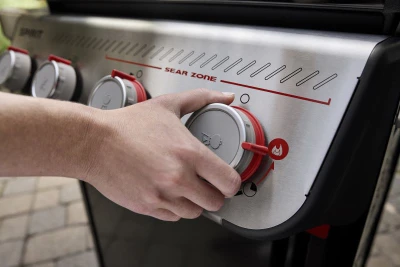 Spirit E-425 Liquid Propane Gas Grill with Four Burners and Sear Station in Black