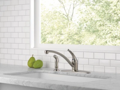 Foundations Single Handle Kitchen Faucet with Side Spray in Stainless Steel Finish