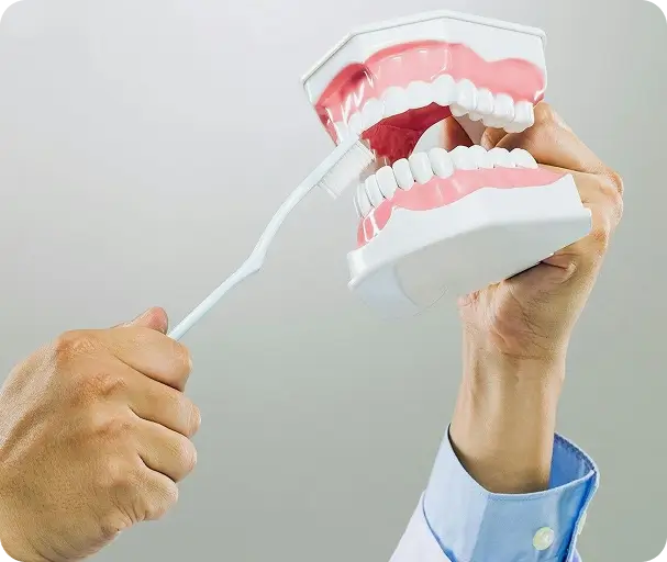 Dr. Issa evaluating a dental emergency patient for same-day treatment in Long Beach.