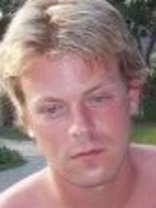 Person who looks like Tim Curry