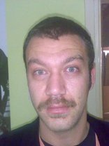 Person who looks like Tim Curry