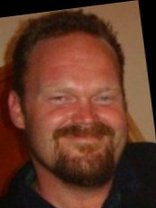 Person who looks like Drew Carey