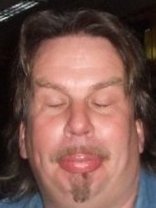 Person who looks like Tim Curry