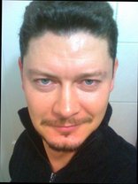 Person who looks like Tim Curry