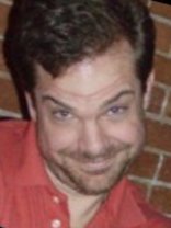 Person who looks like Tim Curry