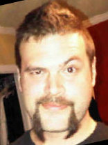 Person who looks like Tim Curry