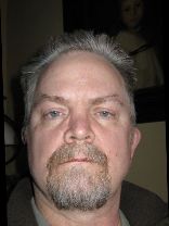 Person who looks like Tim Curry