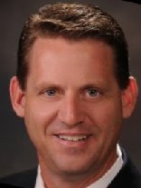 Person who looks like Greg Kinnear