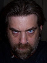 Person who looks like Tim Curry