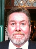 Person who looks like Tim Curry