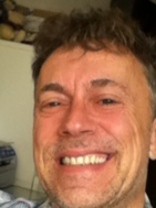 Person who looks like Tim Curry