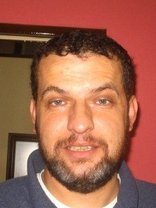 Person who looks like Tim Curry