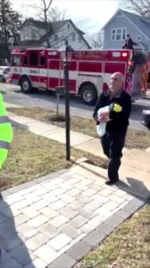 Firefighters deliver couple's adopted son