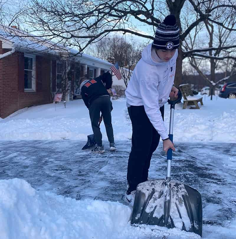 football-athletes-shovel-driveways-2