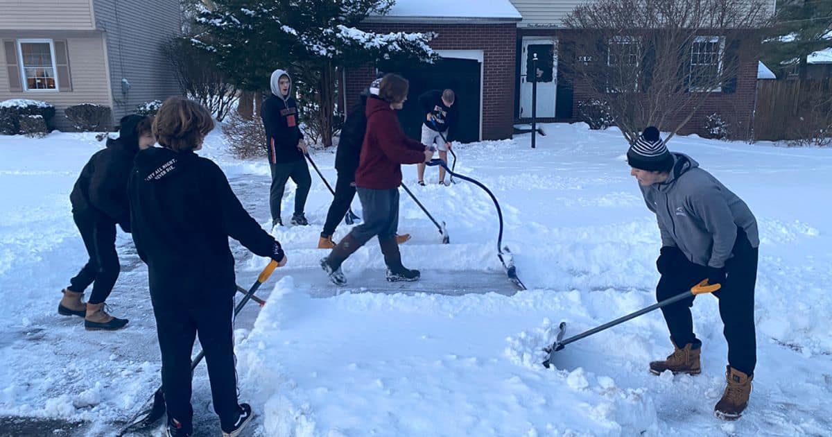 football-athletes-shovel-driveways