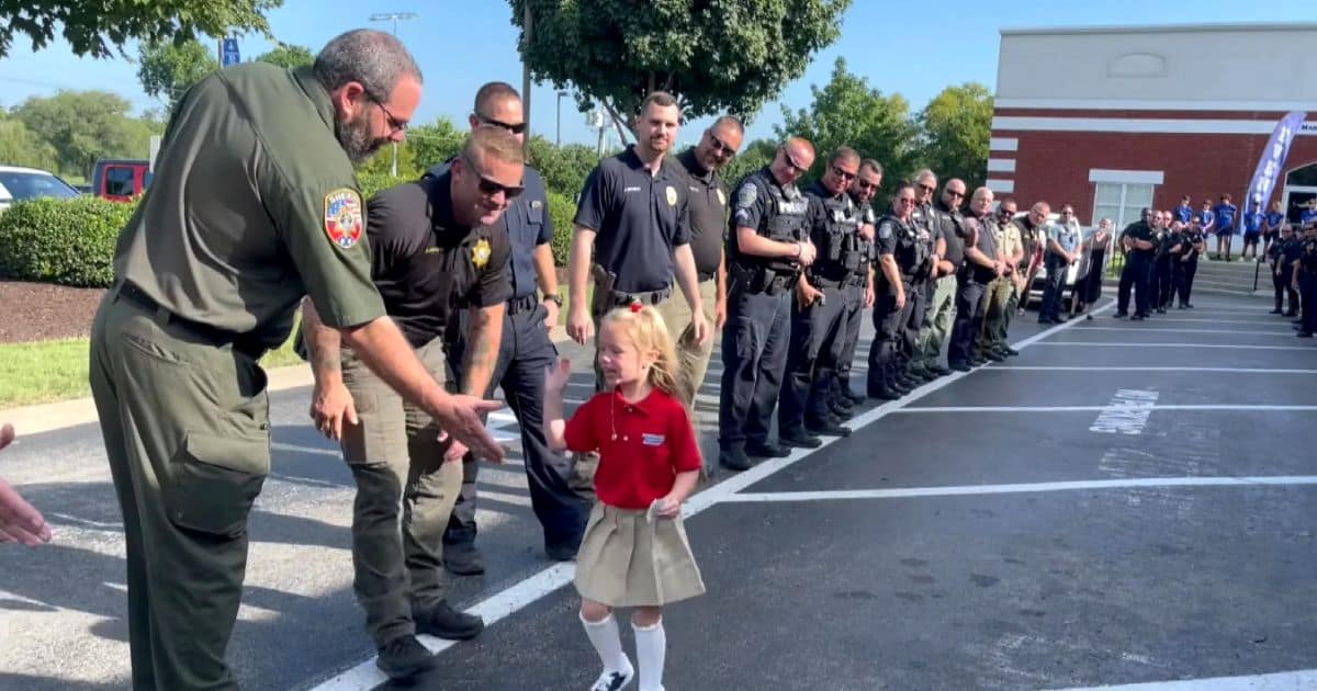 police-officers-escort-little-girl-school